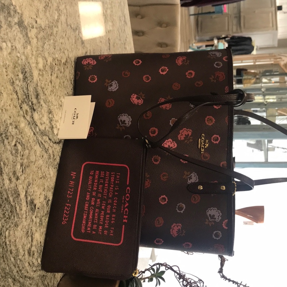 Coach Tote with separate pouch.